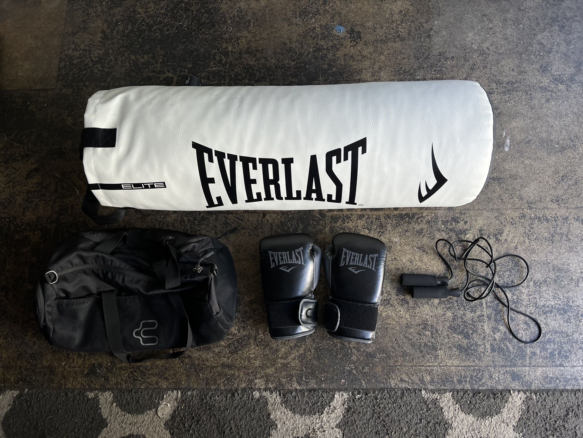 Punching bag (75 or 80lbs I believe) Gloves 14oz Jump rope Gym Bag