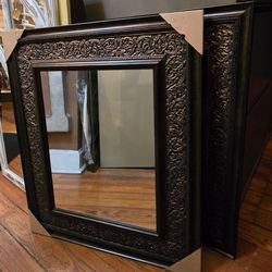 New, Framed wall mirror. 27 tall 25 wide