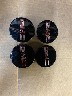 Oem # 10-16 gmc acadia oem center caps black and red 2 1/2 inch center caps