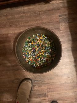 Old small barrel of marbles, not sure what they are worth I just know my grandpa started collecting in around the 1920’s