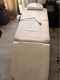 White electric exam table