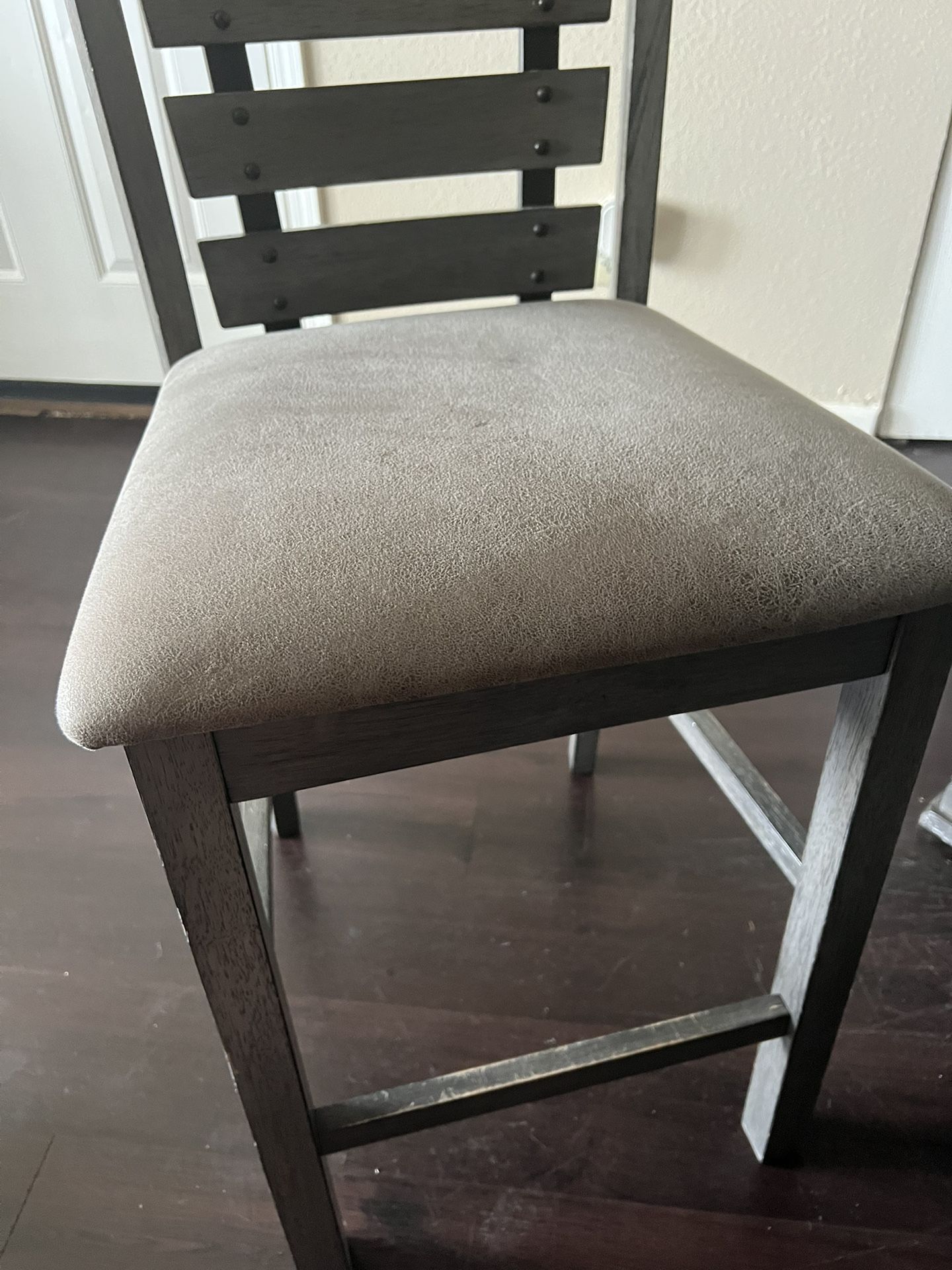 Table And (4) 24” Stool Chairs.