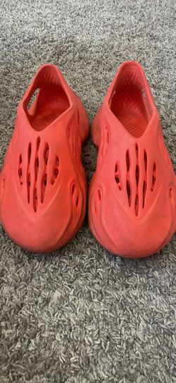 Orange foam runners (fake), size 6 in women’s.