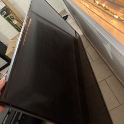 Tv Stand And A 75 Inch Tv 