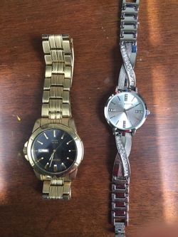 Men’s gold watch and women’s silver watch with diamonds