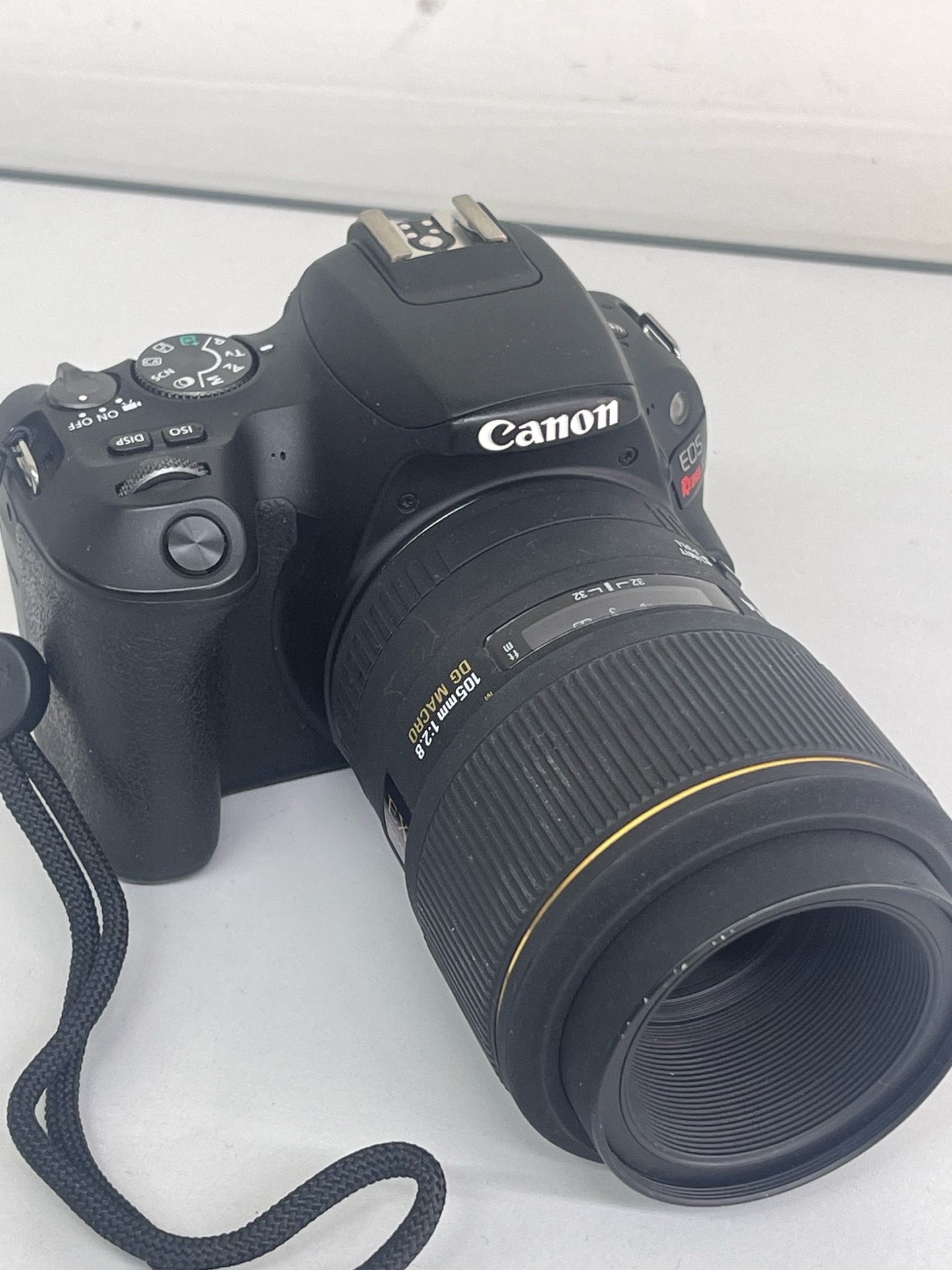 Canon camera EOS Rebel sl2 w/ sigma lens 105 mm1:2.8 Dg Macro great condition working perfect two batteries and double charger / no memory card.