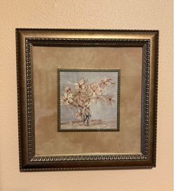 Gold framed picture of flowers