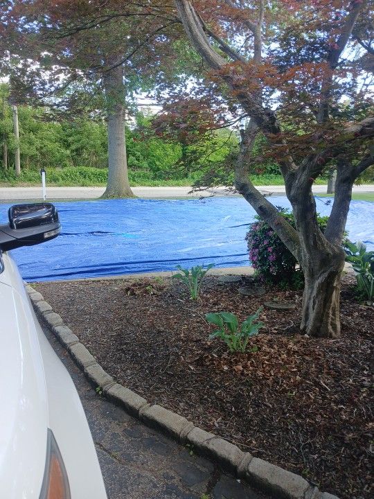 Free 40 X 60 LIGHT BLUE TARP MESSILY ROLLED UP