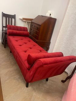 Red velvet upholstered storage bench