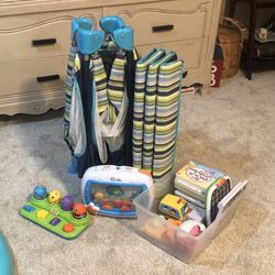 Pack and play nighttime sleeping kids, toys books all together