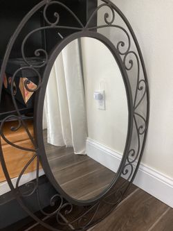 Oval iron mirror