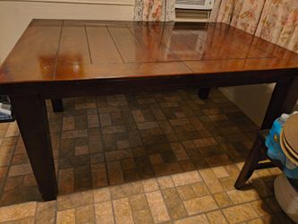 Dining table with extra leaf for Middle seat's six or more including chairs