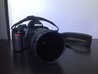 Nikon D3100 DSLR with 18-200 auto focus lens
