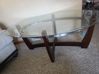 Oval coffee table with glass top