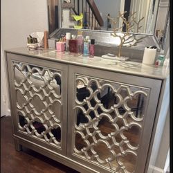 Elegant Mirrored Accent Cabinet with Decorative Trim and Marble-Style Top