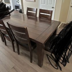 Dark wood table and 4 chairs
