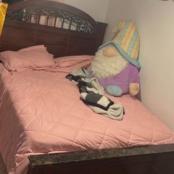 A Queen Size Wooden Bed