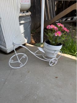 Tricycle potter with faux flowers