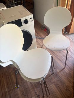 4 white wooden chairs