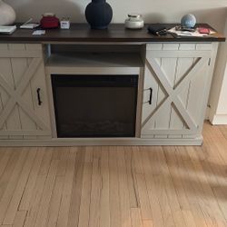 Fireplace Electric  And Blows Great With Two Storage Cabinets 