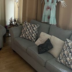 Couch and stool and square table.