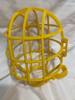 4 Yellow plastic bulb cage designed to protect work lights.