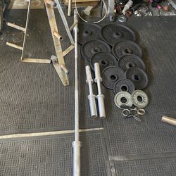 245lbs of Olympic weights with 7ft bar plus adjustable dumbbells handles plus weights tree