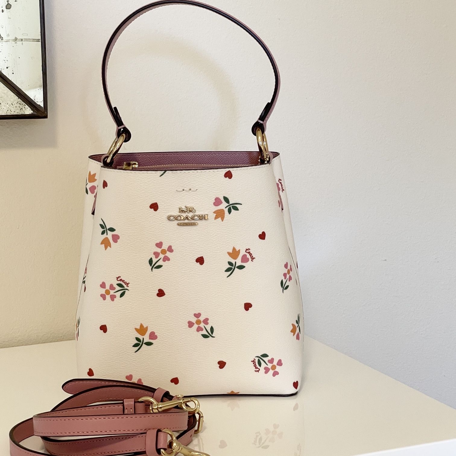 Shop Coach 2022 Cruise Small Town Bucket Bag With Heart Petal Print (C7976)  by Ocealani