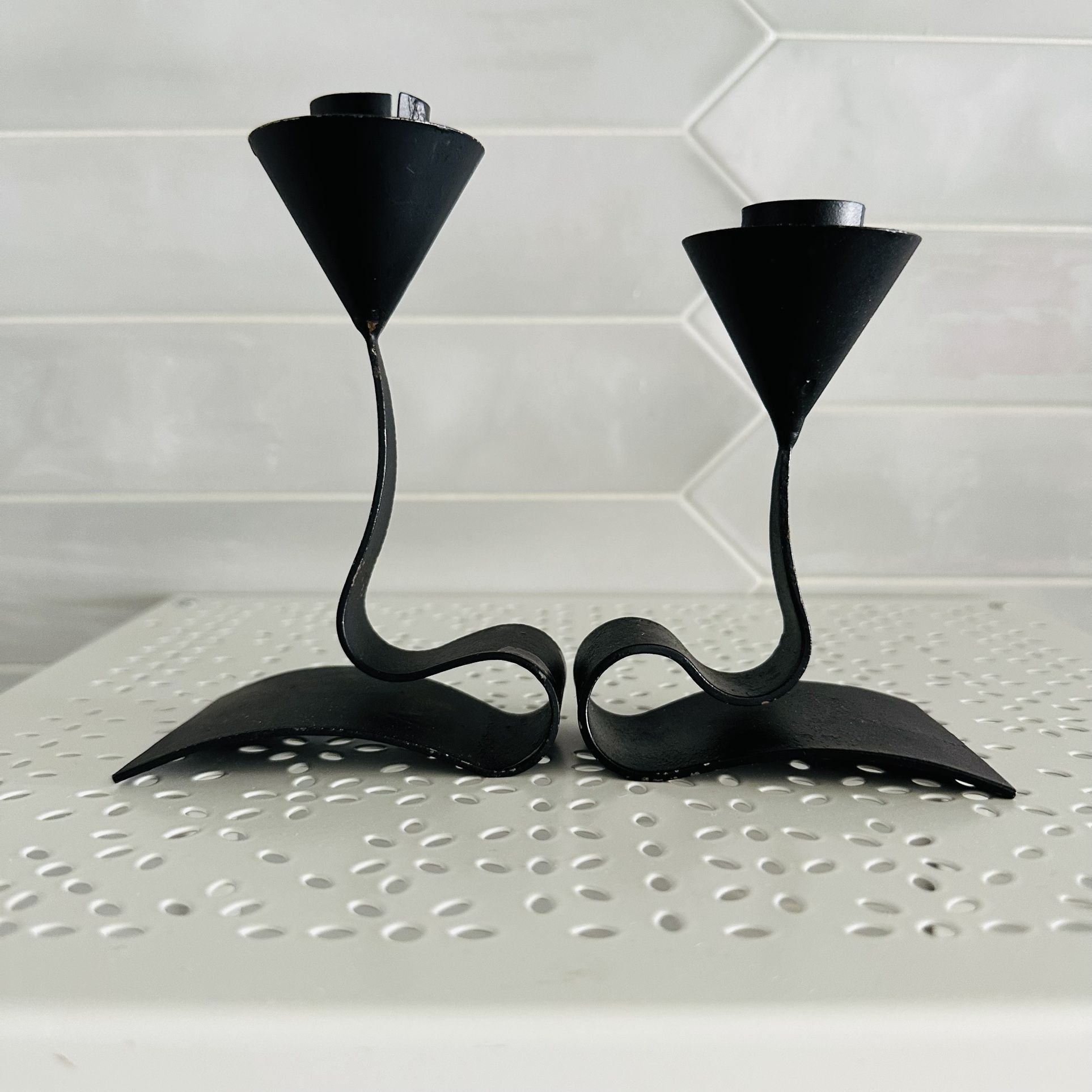 Set of two vintage MCM Sweden black metal candle holders