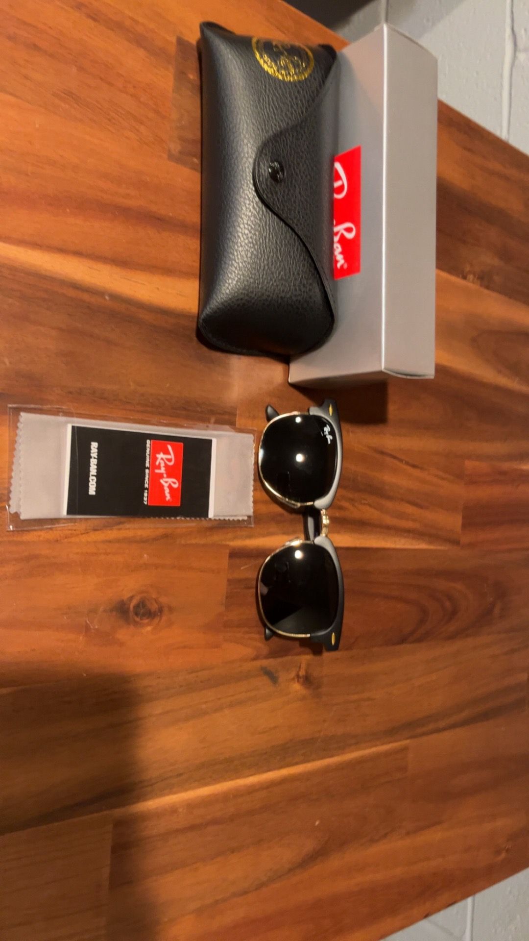 Black and gold ray ban glasses