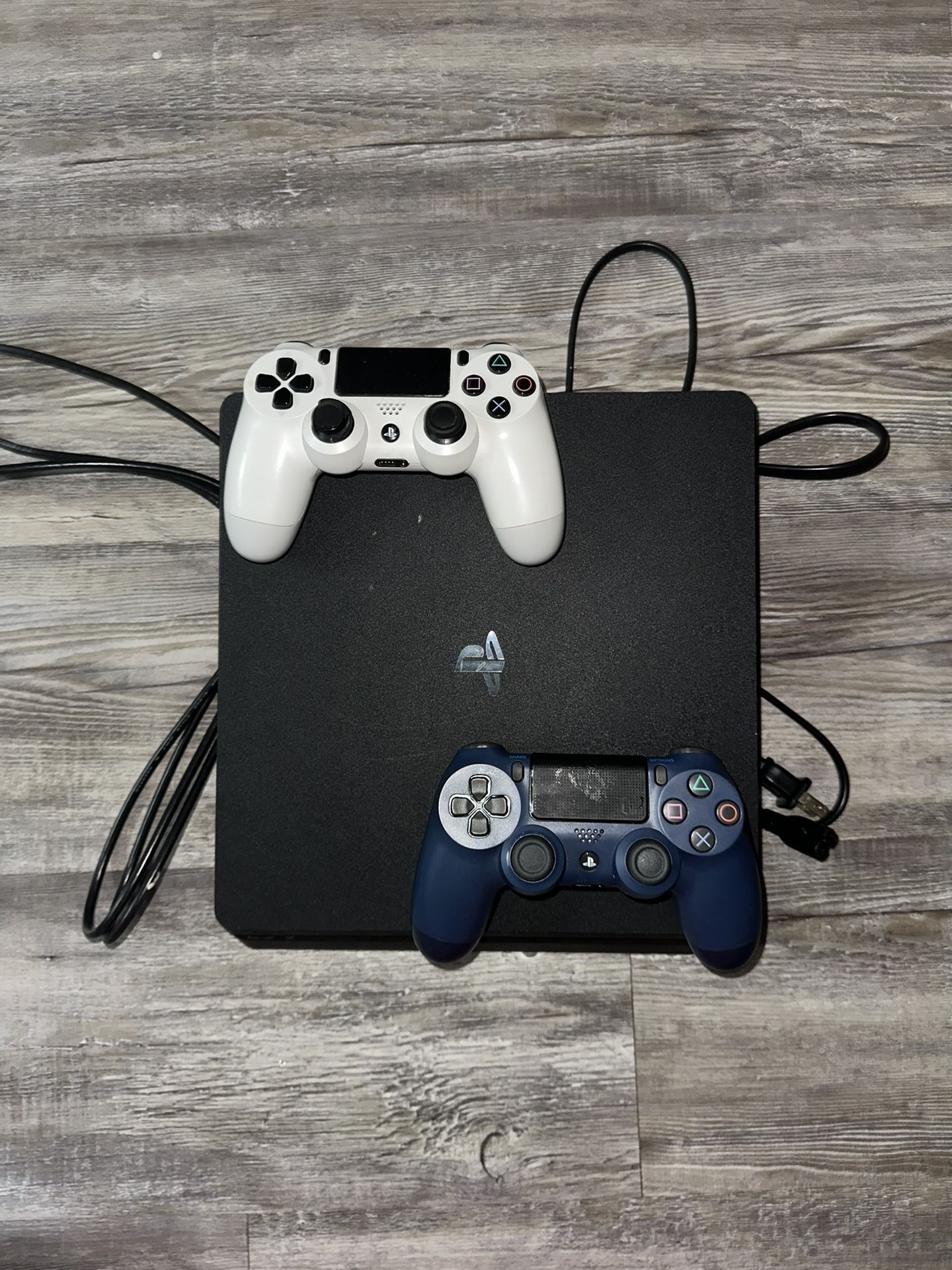 PS4 in great condition. Comes with all cables, 2 controllers, and 5 games. Everything works perfectly.