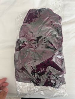 Stylish athletic set has a maroon and black  and abstract print and purple
