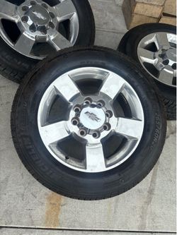 USED TIRES AND WHEELS  20”. 8 LUGS CHEVY
