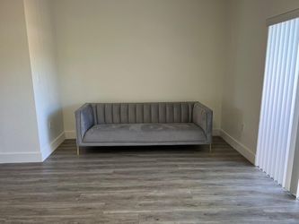 Gray Channel Tufted Sofa with Gold Legs