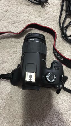 Canon EOS DSLR Camera with Lens and Strap