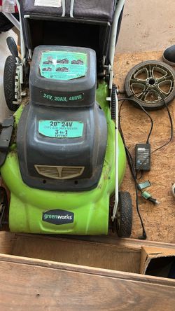 Green works 20 inch 24 V cordless lawnmower… Wheel is off.
