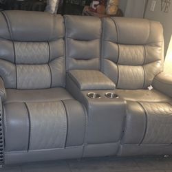 3 Piece leather reclining living room set.