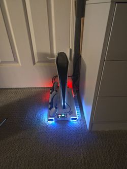 PS5 slim with charging/ cooling fan.