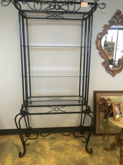 Metal stand with three glass shelves