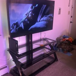 55 pulgadas, una televisión y el mueble también