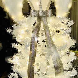 Angel illuminated anytime Christmas Tree 4 feet tall with hand done  Rhinestone work to body, belt , bow, and flowing drape down front of tree.