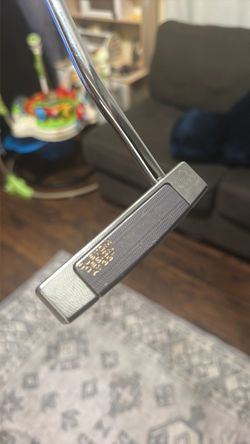 Scotty Cameron and crown golf putter