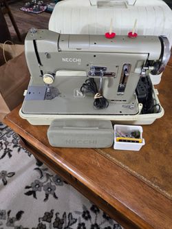 Necchi Nora Sewing Machine with attachments.