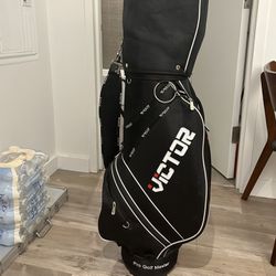 golf bag + 3 clubs (sand wedge and 3 wood) 