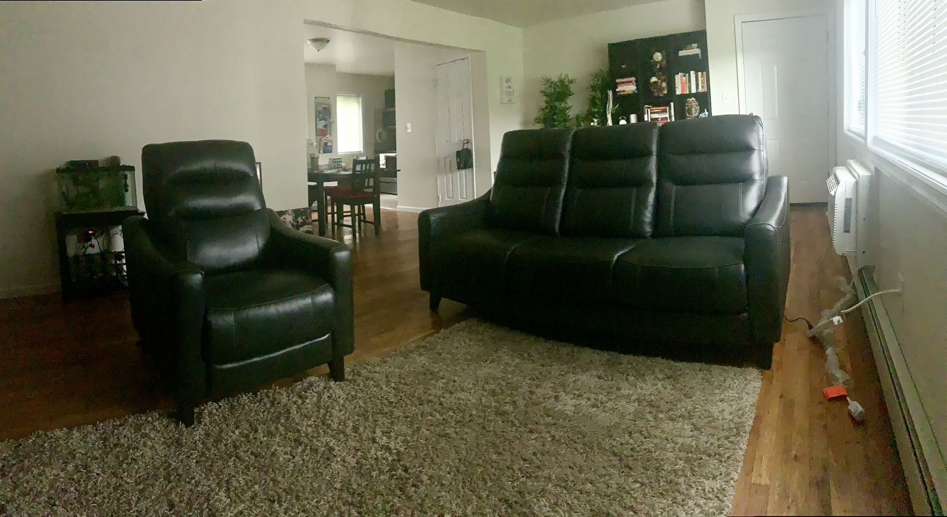 Black Leather Couch + Matching Chair – Reclining Style – $1250