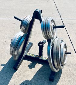 STANDARD CAST IRON FREE WEIGHTS TOTALING 345 LBS PLUS GOLDS GYM WEIGHT RACK: STANDARD CAST IRON FREE WEIGHT PLATES RESELL VALUE AT .75 CENTS PER POUND
