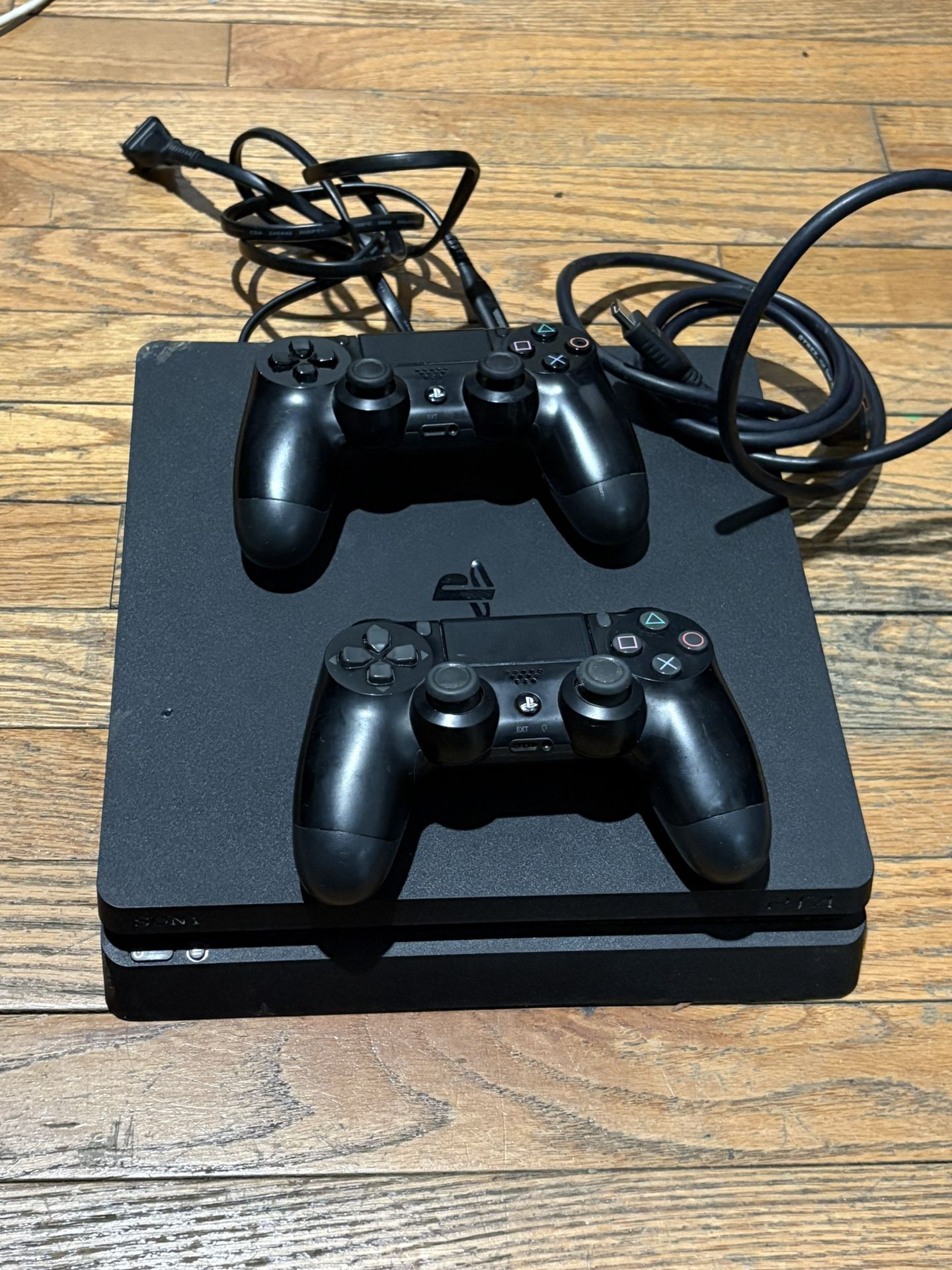 PS4 Slim With Power Chord And HDMI Chord And 2 Controllers