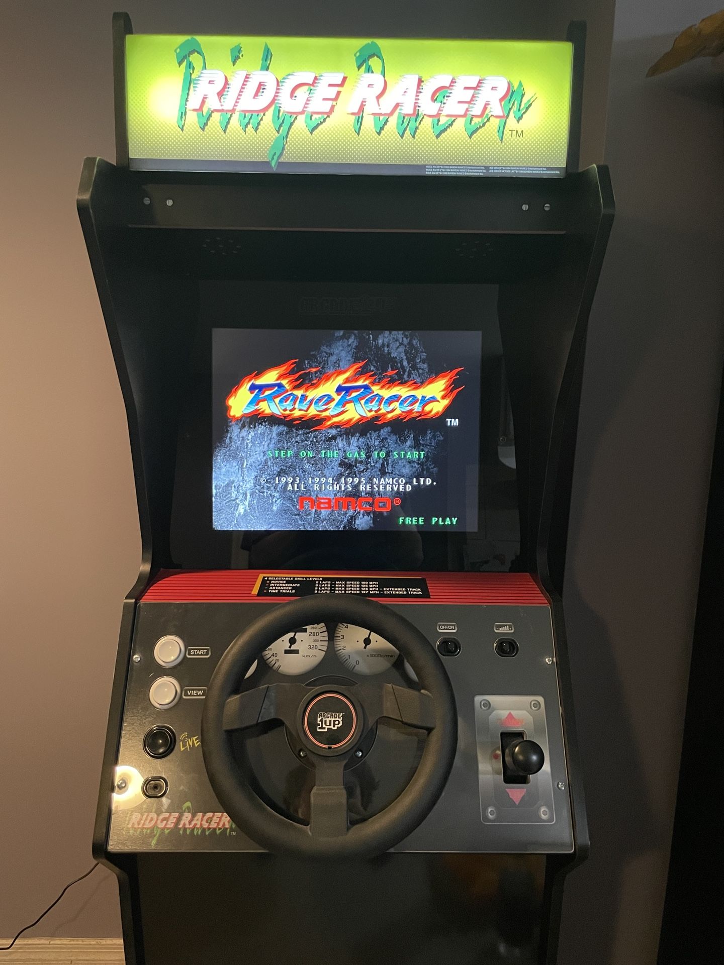 Arcade1Up Ridge Racer Arcade Machine — 5 Games in 1 + Rumble Steering Wheel