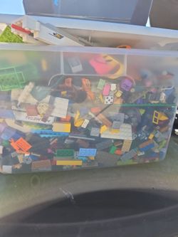 box of random legos and toys