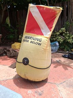 BROWNIE'S THIRD LUNG 3D BUOY measures 36-inches high and 18-inches wide. The bright yellow triangular inflatable displays three 12” x 12” official red